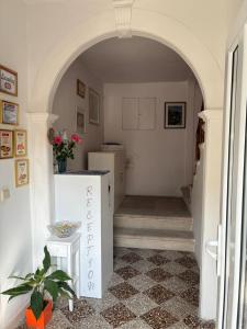 an archway leading into a kitchen with a refrigerator at guesthouse Libertas 3 in Dubrovnik +12 photos