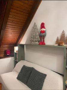 a childs bedroom with a shelf with a toy christmas tree at Erika in Tarvisio