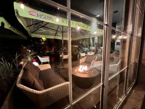 a room with a fire pit in front of a building at Hotel Nowy Dwór in Trzebnica