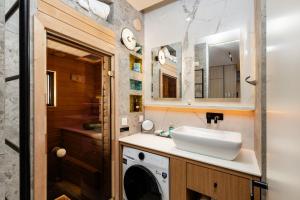 a bathroom with a sink and a washing machine at Chill out Spa Studio in Kotor +15 photos