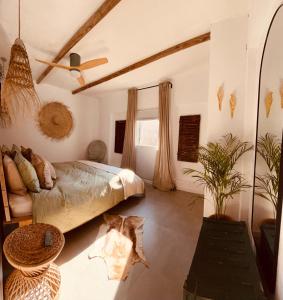 a bedroom with a large bed and a window at Finca W - Coín - Málaga - Andalucía in Coín