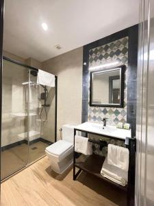 a bathroom with a toilet and a sink and a shower at Mape Loft Rural ALJIBE in Algar +24 photos
