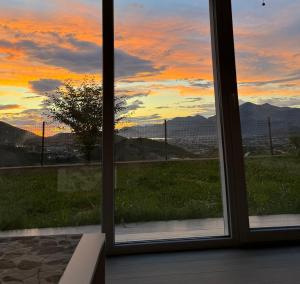a view from a window of a sunset at Bela Bar in Pečurice