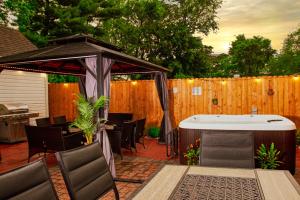 a patio with a hot tub and a gazebo at Tonel Paradise in Rosedale