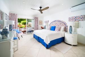 a bedroom with a bed and a living room at Glitter Bay Apartment 104 in Saint James