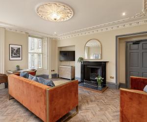 a living room with a couch and a fireplace at The Victorian Suite in Marske