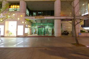 an empty building with a tree in front of it at SHseoul in Seoul