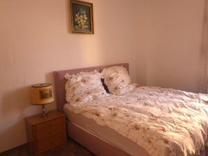 Giường trong phòng chung tại Ferienzimmer Tri Ky +2 ảnh