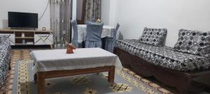 a living room with a couch and a chair at Appartcirta in Constantine