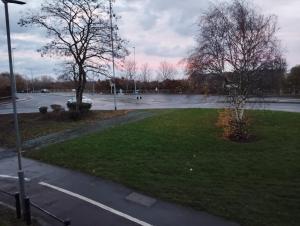 an empty parking lot with a dog in a park at Double room Thornaby train station in Stockton-on-Tees