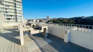a bench on a balcony of a building at Viabo in Viña del Mar