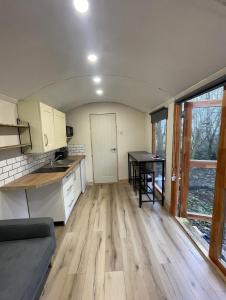 a kitchen and dining room with a table in it at Rectory Hideaway in Reedham