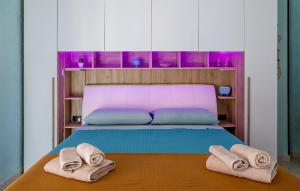 a bedroom with a bed with towels on it at Perla del Salento in Brindisi