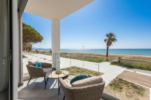 a view of the beach from the balcony of a house at Luxury beach front in Torre Grande