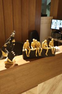 a group of wooden figurines sitting on a table at Calmaa Kairo in Cairo +71 photos