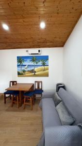 a living room with a couch and a wooden table at Gerês Natura in Valdosende