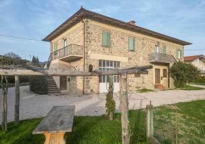 a house with a cross in front of it at Agriturismo Podere Sant' Agnese - Suite Apartment in Bibbiena