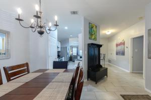 a dining room and living room with a dining table at Modern Updates - Great Location - King Bed- BMT in San Antonio