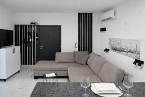 a living room with a couch and a table at Avis 1 in Igalo