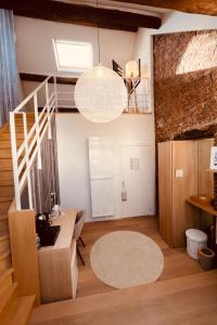 a living room with a staircase and a chandelier at DEUXHOMMES Boutique B&B Massage&Spa in Hasselt +46 photos