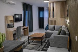a living room with a couch and a table at Avis 2 in Igalo
