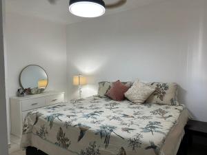 a bedroom with a bed and a mirror at Casa Antonio in Reynosa