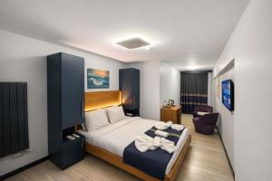 a hotel room with a bed and a chair at VAMA TAKSİM Hotel in Istanbul