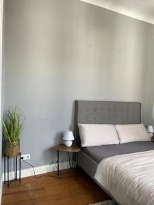 a bedroom with a bed and a side table at Wohnung Karl-Marx 2 in Trier
