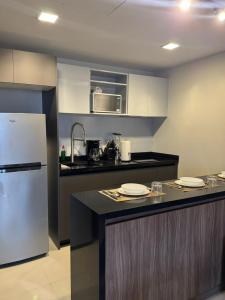 a kitchen with a refrigerator and a counter top at Luxury loft for 2 to 4 people in Monterrey
