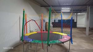 a colorful trampoline in a room with at Happy day chácaras in Uberlândia