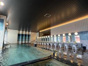 a large pool of water in a large building at Tokigasane in Kaga