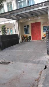 a garage with a red door on a house at Le Meilleur Classic L Bangkok and Modern Wing is at no 3 Jln Yeoh Guan Seok in George Town