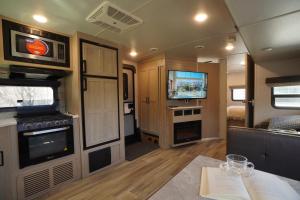 an rv living room with a tv and a table at NamSan203 Guest house in Seoul