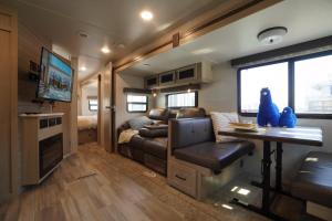 a living room with a couch and a table in a trailer at NamSan203 Guest house in Seoul