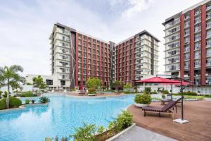 an image of a swimming pool at a hotel at Mactan Cebu Cozy Relaxing Studio with Pool View Balcony in Pajak