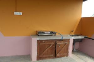 a room with a counter with a radio on it at Shanta Ghar A Rustic Guesthouse in Chitwan +20 photos