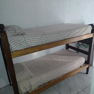 a couple of bunk beds sitting on a shelf at Hospedaje El Colibri in Ezeiza