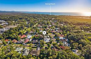 an aerial view of a suburb with a house with the number eight at Barefoot at Sunrise Guest Suite in Byron Bay