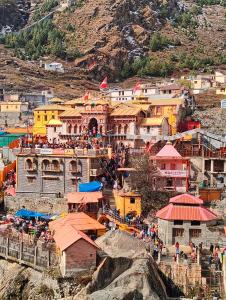 a group of buildings on top of a mountain at Hotel vivekanand in Badrinath