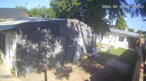 a small white house with a tree in front of it at Hospedaje El Colibri in Ezeiza