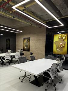 a conference room with white tables and chairs at Modern studio apartment Parque de la 93 in Bogotá