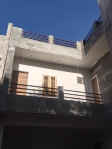 a view of a building with a balcony at Akshay Hotel in Bikaner +18 photos