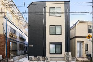 a building with two speakers on the side of it at Reberty Haneda in Tokyo