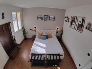a bedroom with a large white bed in a room at Chez Nous in Comacchio