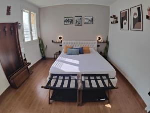 a bedroom with a large bed in a room at Chez Nous in Comacchio +6 photos