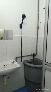a bathroom with a bath tub and a sink at 571 Seroja Homestay in Sungai Petani +11 photos