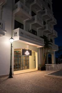 a building with a street light in front of it at Cybade Hôtel in Phú Quốc