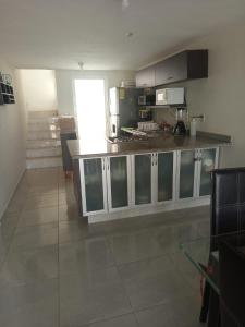 a kitchen with a counter top in a room at Villa en Terrasol Diamante in Acapulco