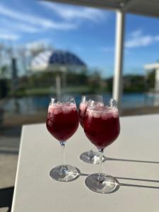three glasses of red wine sitting on a table at Le Grá Vineyard and Winery in Masterton