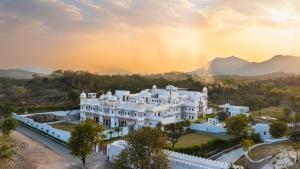 an aerial view of a resort with mountains in the background at lebua Udaipur Daulatgarh in Udaipur